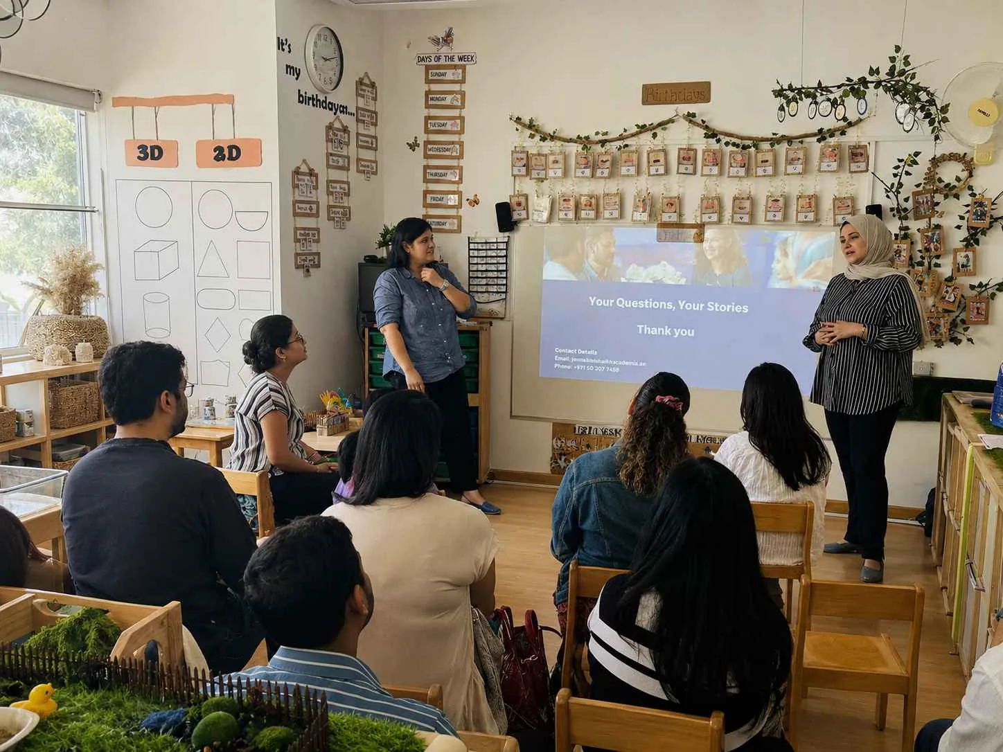Parents attending a meeting in a nursery classroom